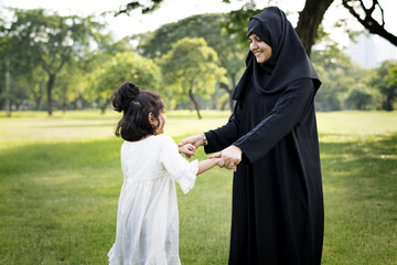 Mother and her daughter in a park