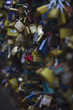 thousands of colored padlocks on the emerald iron fence of the bridge
