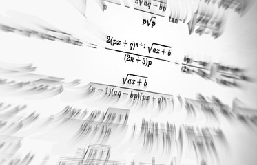 Large number of mathematical formulas focus on a white background