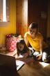 © Wavebreak Media - Mother and daughter using laptop in bedroom