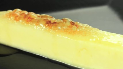 Wall Mural - Gratin traditional Brazilian curd cheese called queijo coalho  with honey