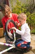 © Wavebreak Media - Mother and son repairing bicycle together