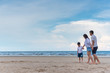 © ic36006 - Happy family on the beach. Parents with Children enjoying a holiday at the sea. Summer vacation concept