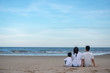 © ic36006 - Happy family on the beach. Parents with Children enjoying a holiday at the sea. Summer vacation concept