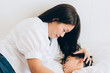 © ic36006 - Happy family. Mother with son under blanket on the bed