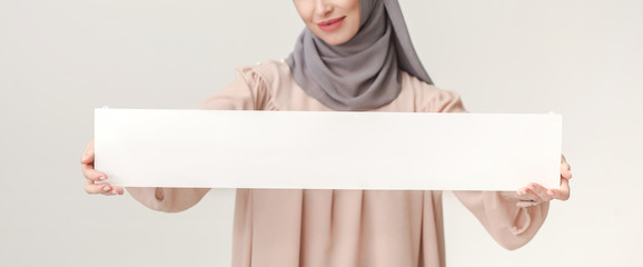 Wall Mural - Islamic woman with blank board on white