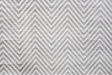 Chevron patterned carpet rug runner in white and gray. Close up