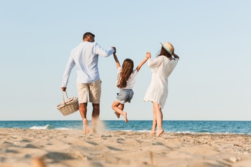 happy family having fun together at the beach.