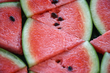 Slices of Fresh Raw Exotic Tropical Thai Fruit Watermelon (Citrullus lanatus) on Banana Leaf