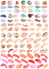 Smears of different makeup products on white background. Color set