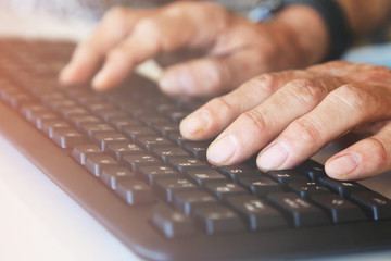 Businessman using computer keyboard