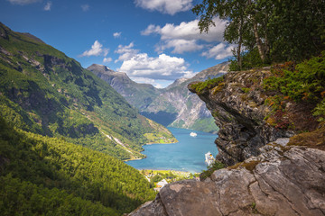 Wall Mural - Geiranger - July 30, 2018: Flydalsjuvet viewpoint at the stunning UNESCO Geiranger fjord, Norway