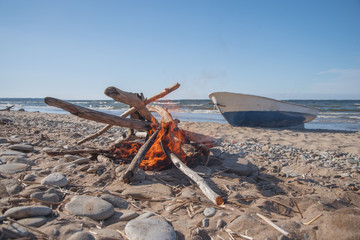 Poster - fire burns near the sea