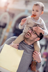 Wall Mural - Father and son having fun in the city