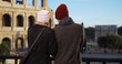 © rocketclips - Rear view of happy couple gazing at the Coliseum