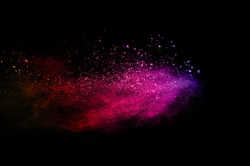 abstract colored dust explosion on a black background.abstract powder splatted background,freeze mot
