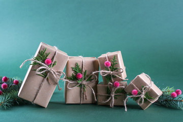 Row of  Christmas gift box and decorations. Old fashion style. On green bright background.