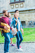 © LIGHTFIELD STUDIOS - Group of multiethnic students with backpacks walking in park