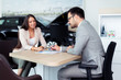 © zorandim75 - Sales manager at a showroom car is worth to the buyer