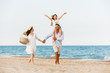 © Drobot Dean - Happy family having fun together at the beach.