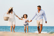 © Drobot Dean - Happy family having fun together at the beach.