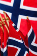 Small Norway flags, on the background of big Norway flag. 