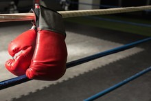 Close Up Of Boxing Gloves On Boxing Ring