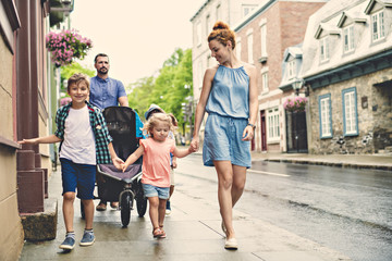 happy family with childs in city.