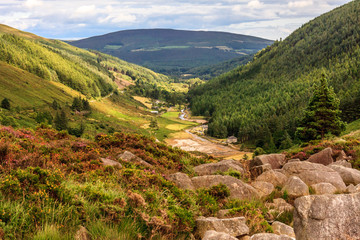 Looking down a valley towards a town in Wicklow National Park