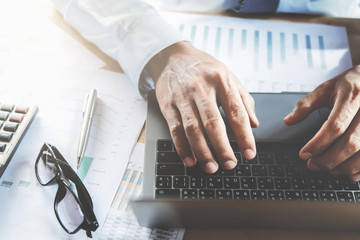 Wall Mural - businessman using laptop in office