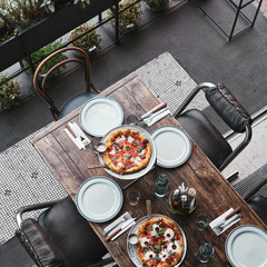 Wall Mural - top view of different delicious pizza on trays at restaurant