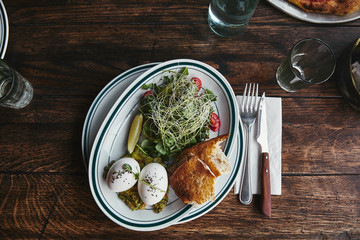 Wall Mural - top view of healthy salad with sprouts and eggs on rustic wooden table