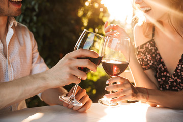 Loving couple sitting in cafe by dating