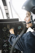 © ADDICTIVE STOCK - Attractive woman pilot sitting in the helicopter