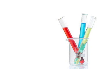 Couloured Laboratory tubes with blue ,red, yellow,liquid in measuring beaker with reflection isolated on white