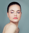 © artmim - Healthy woman portrait. Perfect female face on blue background. Plastic surgery, cosmetology, skincare and wellness concept