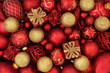 © marilyn barbone - Red and gold christmas bauble decorations forming an abstract festive background. Traditional christmas greeting card for the holiday season.