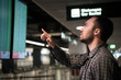 © romankosolapov - Man In Front Of Arrivals And Departures Board At The Airport. Travel concept