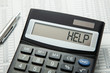 © adragan - Calculator and word help on the display. Assist in calculating the revenue