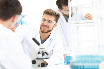 Wall Mural - closeup.smiling team of biologists in the lab