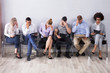 © Andrey Popov - Bored People Waiting For Job Interview