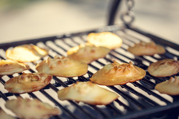 Baked sheep cheese on a grill grille. Polish regional sheep's cheese produced in the mountains.