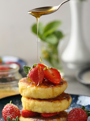 Wall Mural - breakfast pancakes with berries and honey