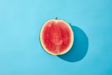 Top View Of Fresh Ripe Sweet Halved Watermelon On Blue