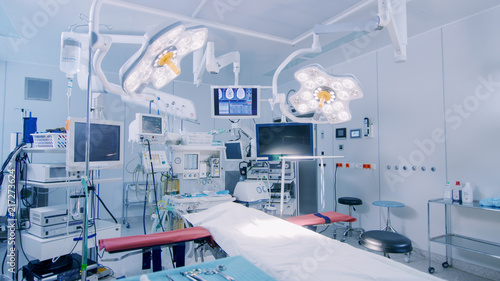 Fotomural Establishing Shot of Technologically Advanced Operating Room with No People, Ready for Surgery