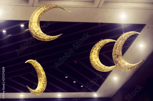 Golden Half Moon Decorations Hanging From The Black Ceiling Half Moon Decorations Hanging From The