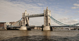 Fototapeta Londyn - View fo Tower Bridge along with River Thames on a sunny day with cloudy sky in London. 
