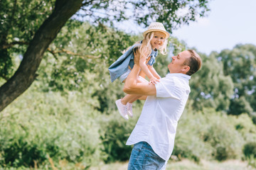 Wall Mural - father spending time with adorable blonde daughter