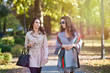 © dobok - two young fashion woman waling in a park in autumn