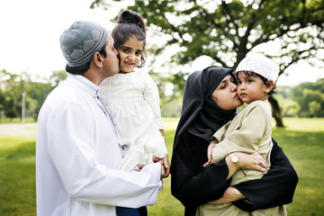 Wall Mural - Muslim family having a good time outdoors